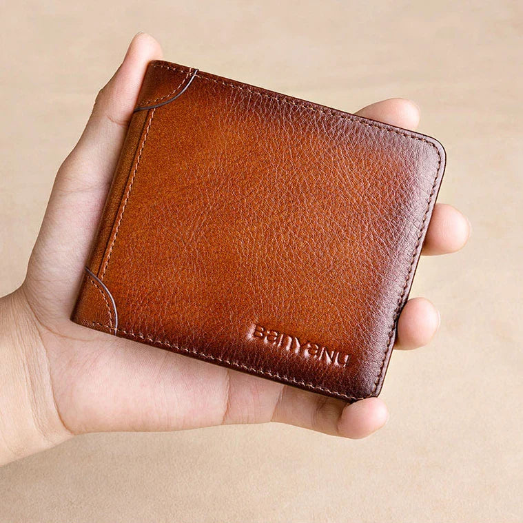 Premium men's short leather wallet with tri-fold design, made from top-grain cowhide leather for exceptional quality and style.