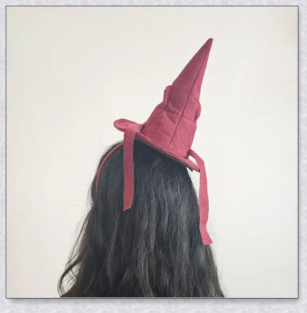 Sortband Halloween Witch Hat Headband in red, green, and brown colours with a detachable witch hat design