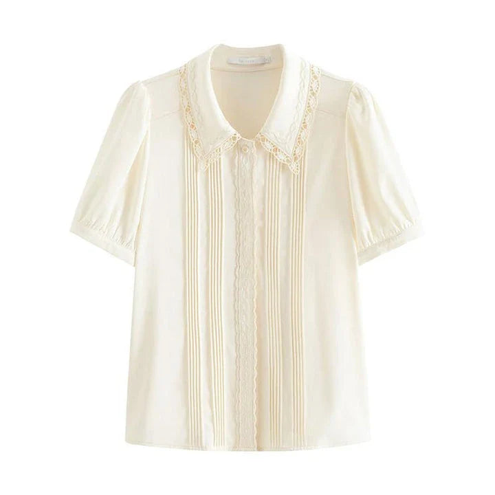 Elegant embroidered polo-neck blouse with petal sleeves, perfect for British summer fashion