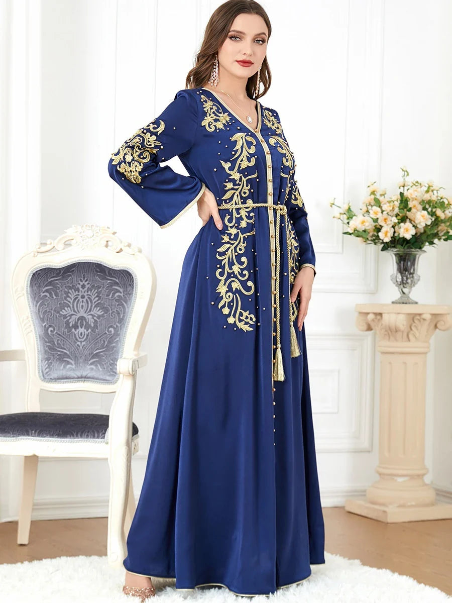 Elegant long-sleeve dress with floral embroidery in a sophisticated sapphire blue colour, suitable for British women