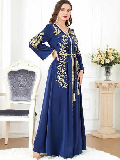 Elegant long-sleeve dress with floral embroidery in a sophisticated sapphire blue colour, suitable for British women
