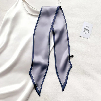 Luxury silk-feel narrow scarf in blue colour, a versatile fashion accessory for the modern British woman