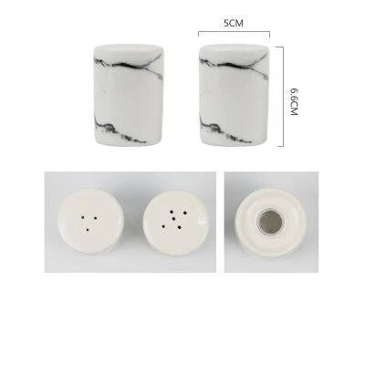 Ceramic salt and pepper shaker set with oil bottle in light grey porcelain finish, featuring minimalist design and easy-grip handles
