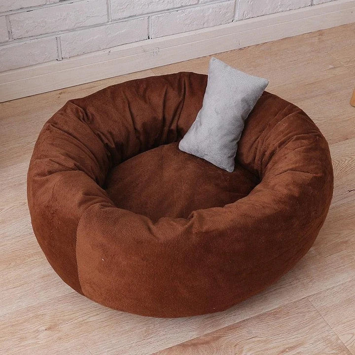 Cosy and comfortable fleece round cat bed in pink colour, perfect for your beloved feline friend to relax and unwind.