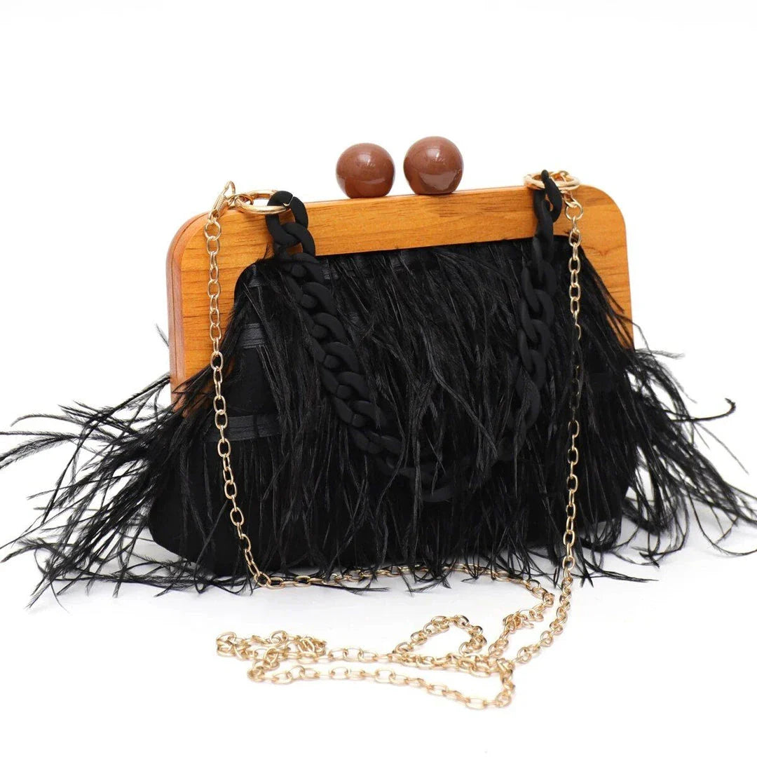 Luxury feather evening clutch with elegant acrylic chain decoration in green colour