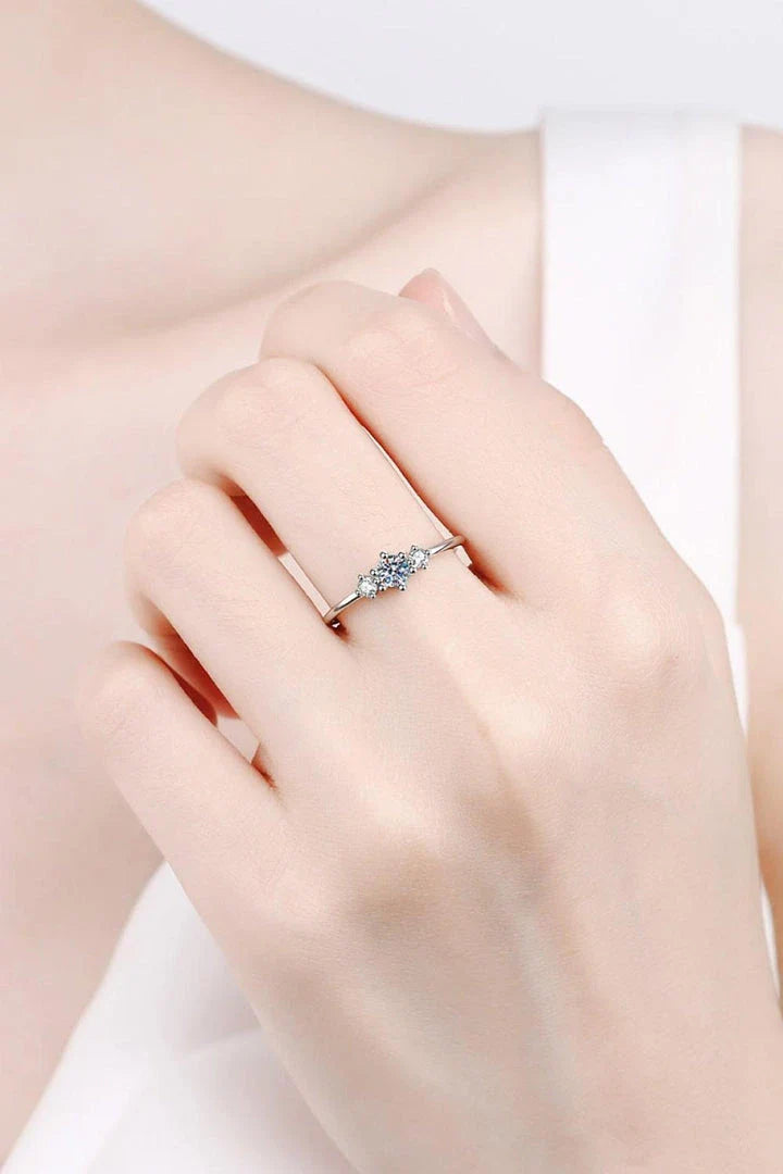 Dazzling sterling silver ring featuring a sparkling moissanite centre stone, perfect for date nights and special occasions.