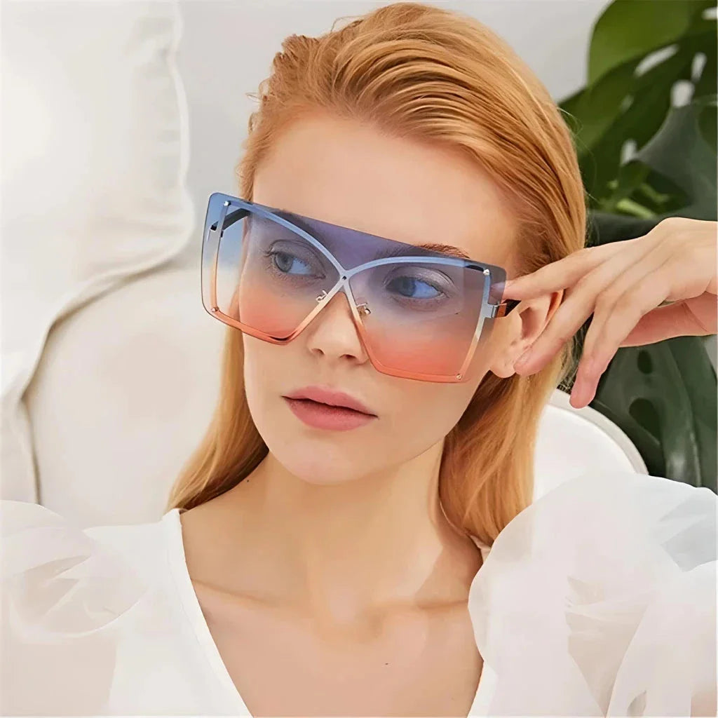 Fashionable oversized flat top sunglasses with gradient lenses and a sleek, rimless plastic frame