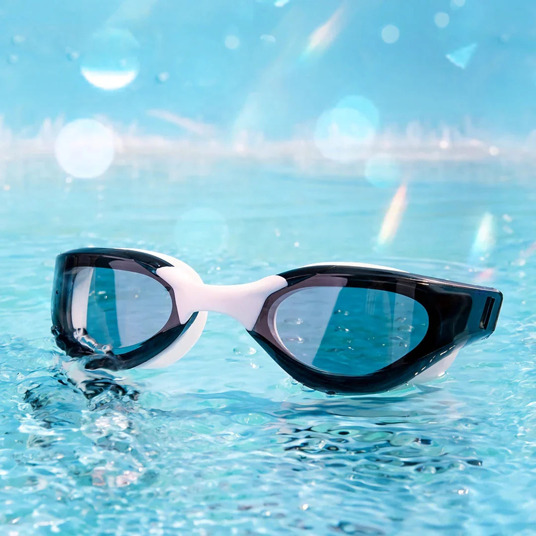 Premium British-made swimming goggles with anti-fog and UV protection technology, designed for clear visibility and comfort in pools, beaches, and water parks.
