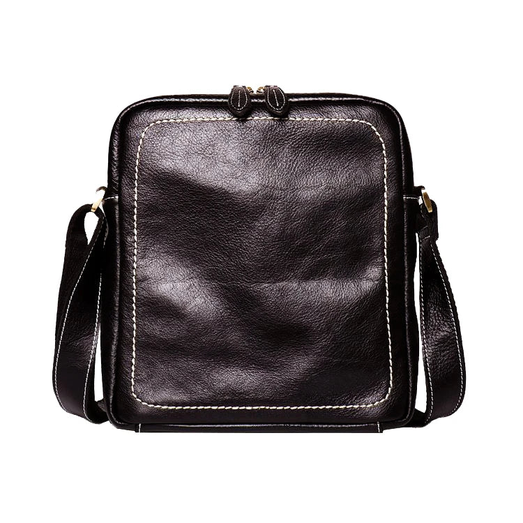 A premium cowhide leather satchel bag with a single shoulder strap, designed for the discerning British gentleman