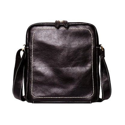 A premium cowhide leather satchel bag with a single shoulder strap, designed for the discerning British gentleman
