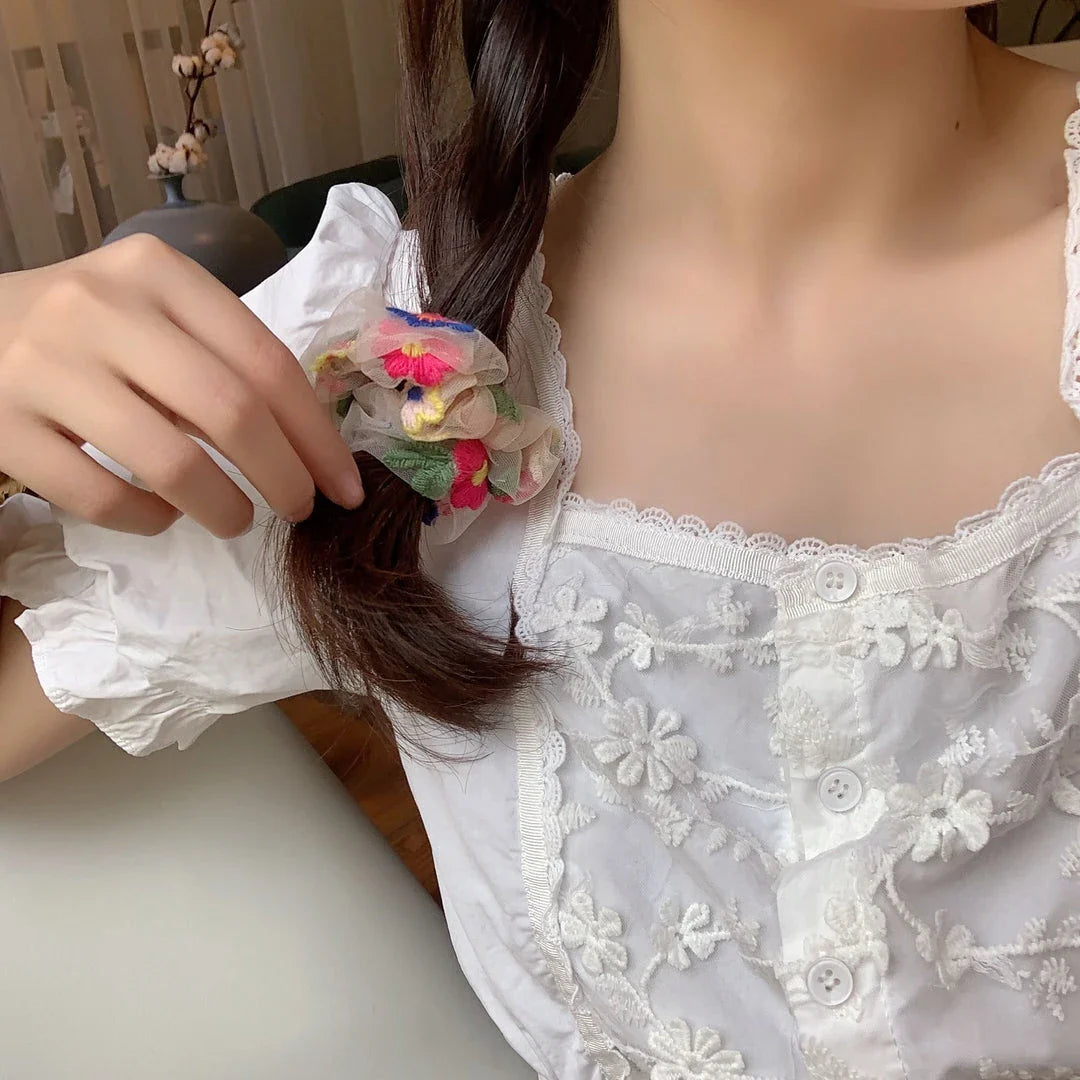 Handmade floral elastic hair bands with soft chiffon fabric and vibrant embroidered daisy patterns, perfect for enhancing everyday style in the UK.