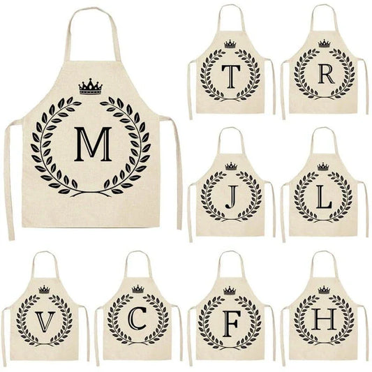 A high-quality kitchen apron featuring a charming crown and letter print design in a premium cotton and linen blend fabric.