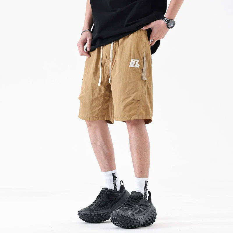 Premium Mountaineering Trousers in black and khaki colours, featuring a relaxed straight-leg fit and durable nylon construction for outdoor adventures.