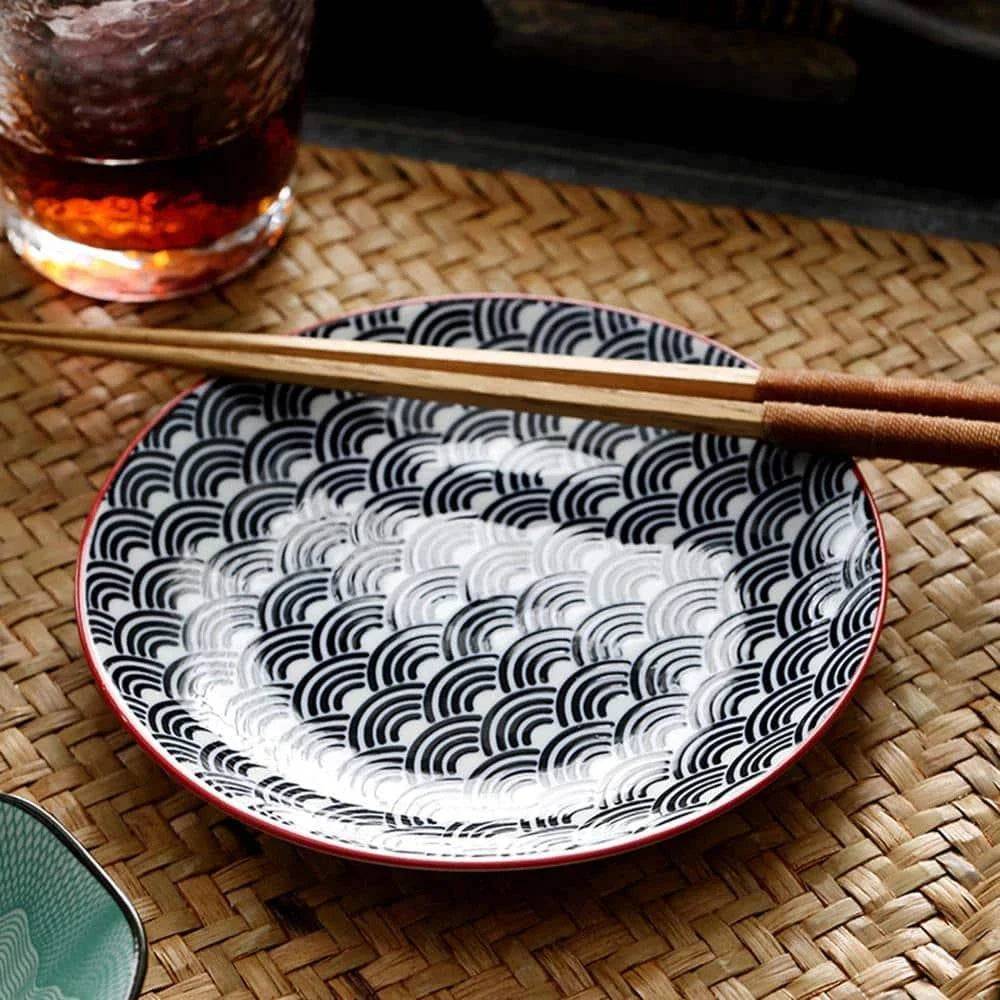 Elegant ceramic plates with vibrant, whimsical prints in a variety of enchanting designs
