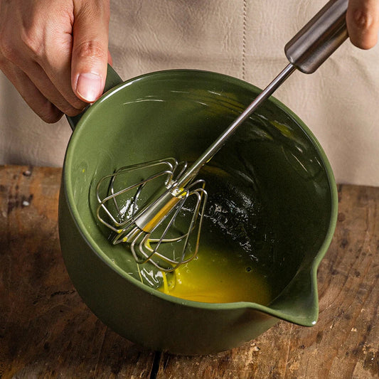 Premium porcelain mixing bowl with ergonomic handle and pointed drainage design for easy baking at home