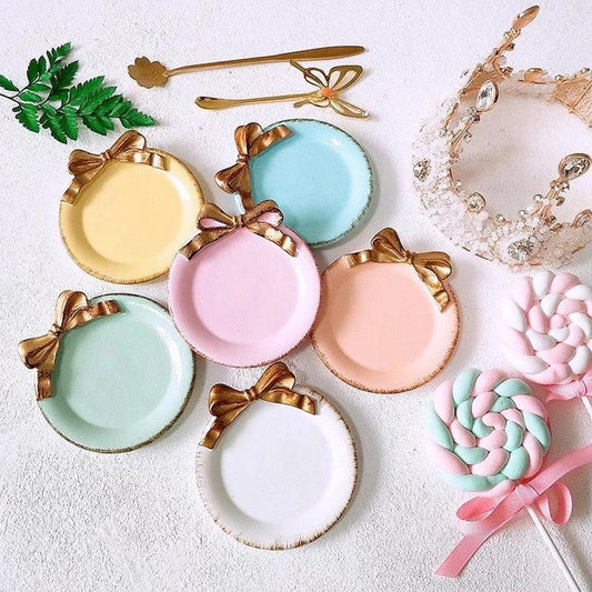 A decorative round storage tray in vibrant colours, perfect for organising small items in your UK home or office