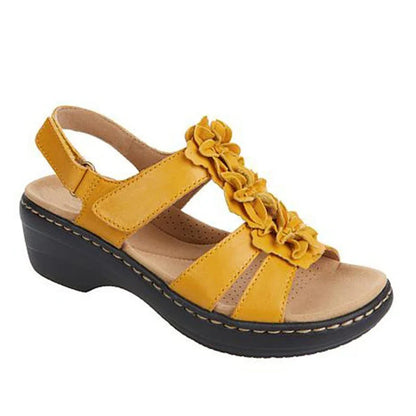 Stylish wedge sandals in a range of vibrant colours, featuring a chic fish mouth design and delicate flower accents for a modern, casual-chic look.