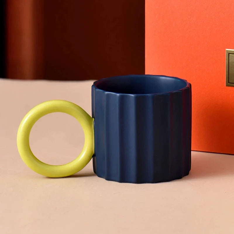 Japanese-style ceramic coffee mug with a unique ripple handle design, perfect for hot and cold beverages