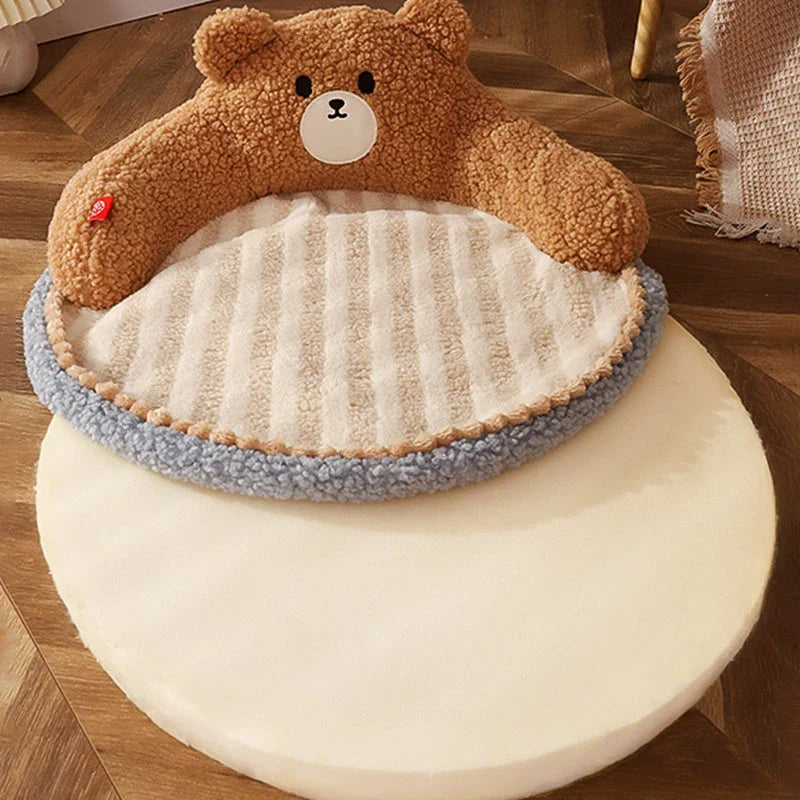 Cosy bear-shaped pet bed in pink colour, designed for cats and small dogs up to 16.5 lbs, with a plush, supportive interior and removable, washable mat.