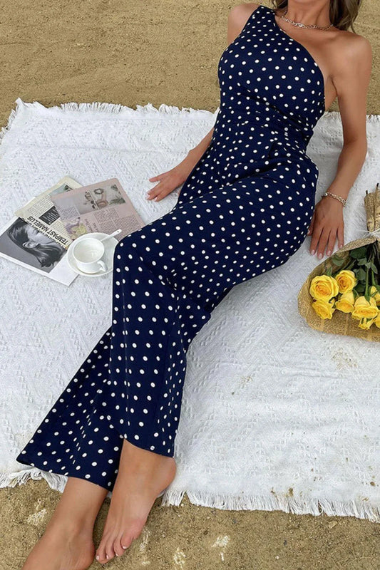 A stylish one-shoulder polka dot jumpsuit with a flattering, figure-hugging silhouette