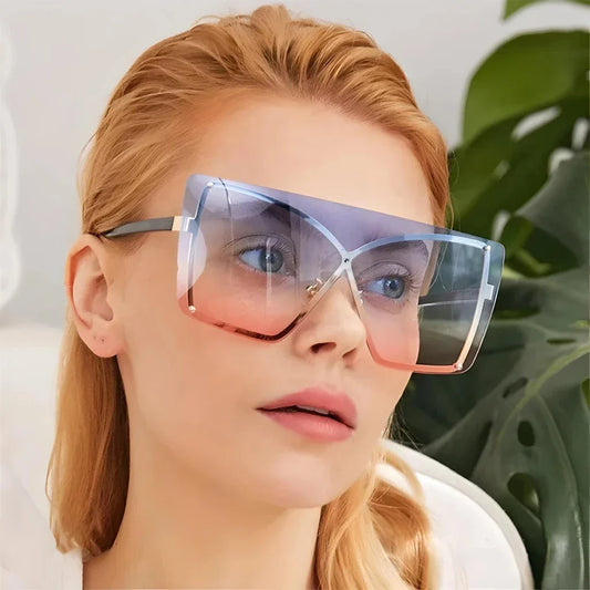 Fashionable oversized flat top sunglasses with gradient lenses and a sleek, rimless plastic frame