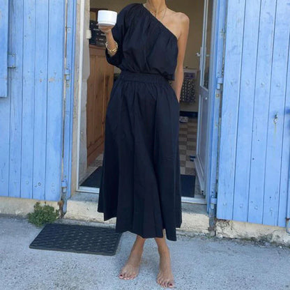 Elegant two-piece mid-length skirt suit with oblique shoulder design, made with premium polyester fabric and boutique four-sided elastic band