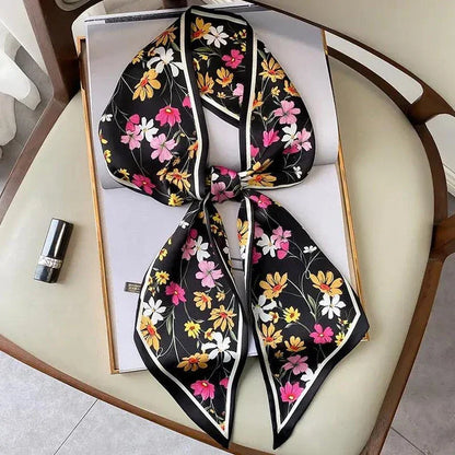 Elegant floral print polyester scarf with a soft, cotton-like texture for versatile seasonal wear