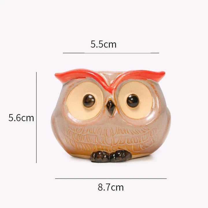 Adorable owl-shaped ceramic flower pot in white, suitable for succulents and small plants