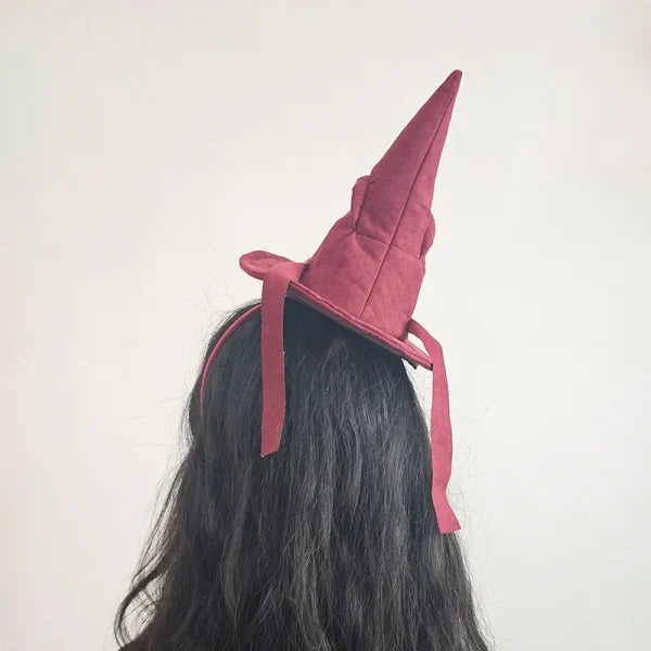 Sortband Halloween Witch Hat Headband in red, green, and brown colours with a detachable witch hat design