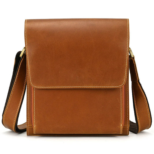 Premium leather crossbody bag with flap closure, vertical square shape, and multiple interior compartments