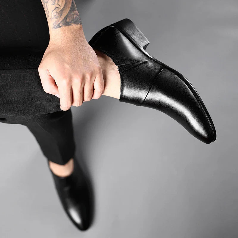 A pair of sophisticated men's leather shoes in black and brown, suitable for both casual and formal wear