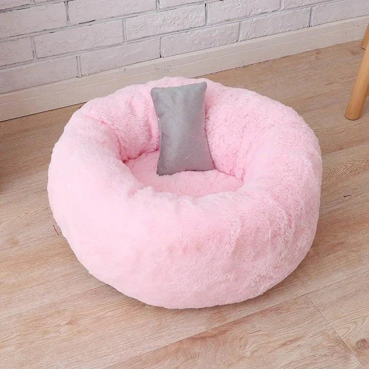 Cosy and comfortable fleece round cat bed in pink colour, perfect for your beloved feline friend to relax and unwind.