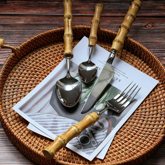 Mirror finish stainless steel cutlery set with bamboo handles, designed for elegant dining experiences