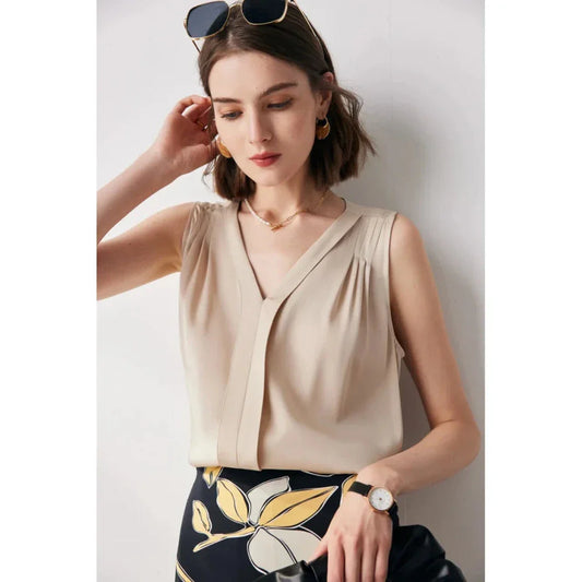 Elegant sleeveless silk blouse in a vibrant blue colour, designed for a sophisticated summer style