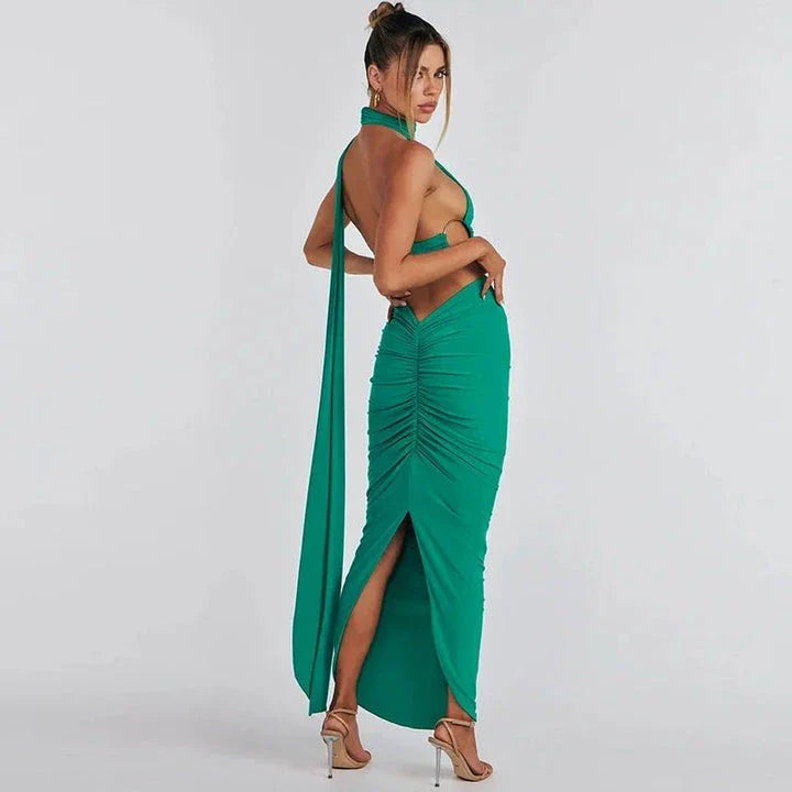 Glamorous backless cocktail dress set with halter-neck crop top and flowing maxi skirt in green colour