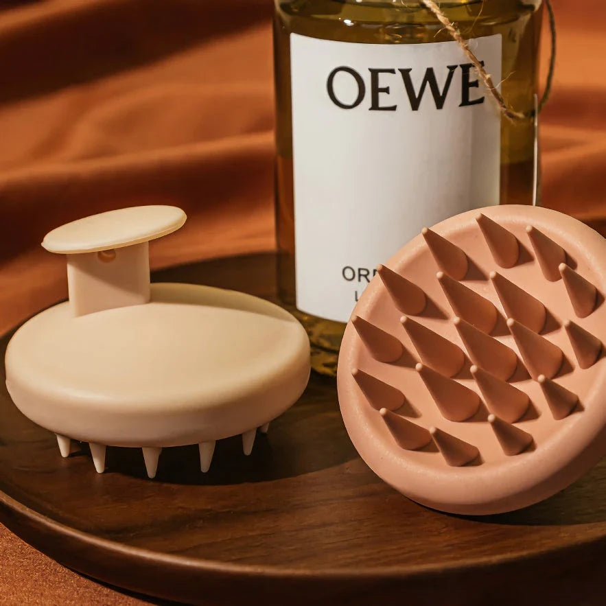 A green silicone scalp massager with soft bristles, designed to provide a soothing hair washing experience and promote healthy hair growth.