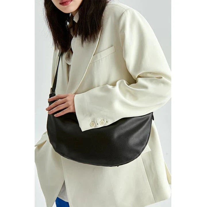 Stylish leather crossbody fanny pack with vintage half-moon design, perfect for everyday use in the UK