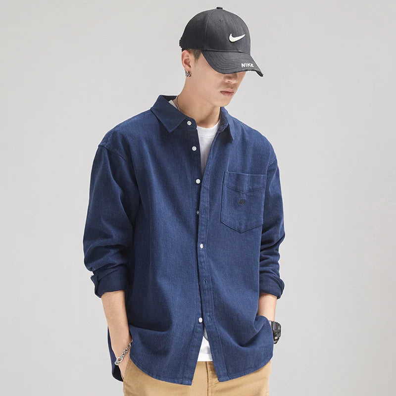 A relaxed, loose-fitting men's shirt in a retro-inspired design, crafted from premium cotton for exceptional comfort and style.