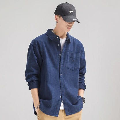 A relaxed, loose-fitting men's shirt in a retro-inspired design, crafted from premium cotton for exceptional comfort and style.
