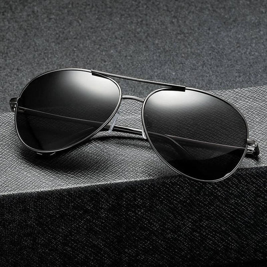 Photochromic Pilot Sunglasses with silver lenses that adjust tint based on light conditions