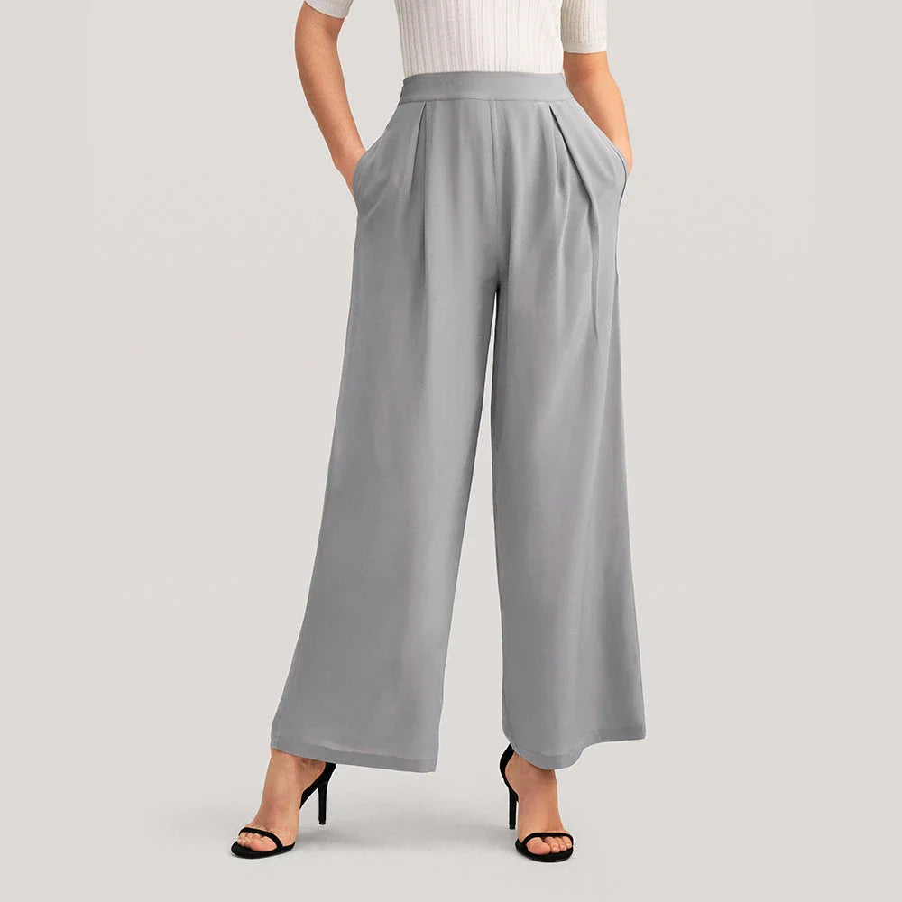 Exquisite grey silk wide-leg trousers with high-waisted design and relaxed fit for sophisticated style