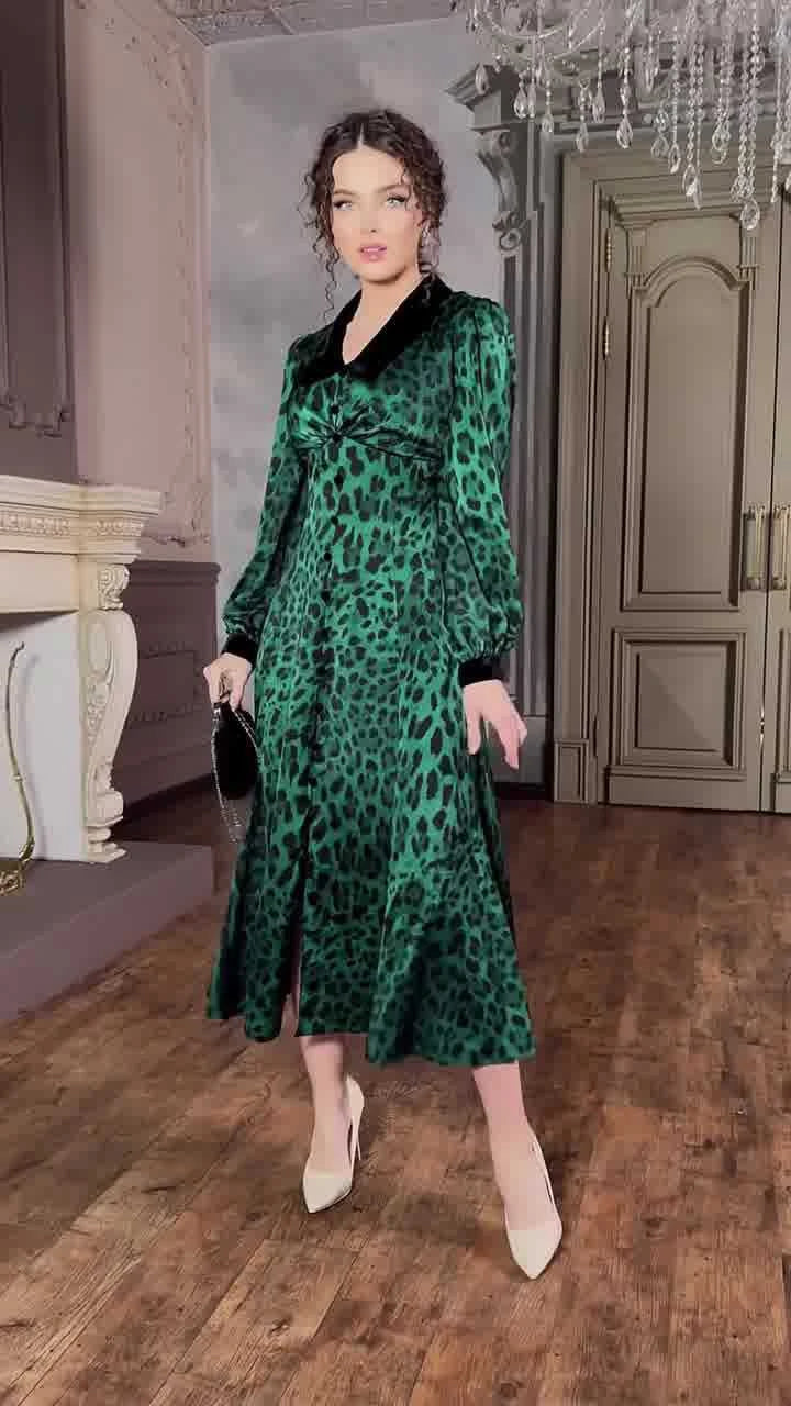 A stylish leopard print dress with a waist-trimming design, perfect for adding a touch of feline fierceness to your wardrobe.