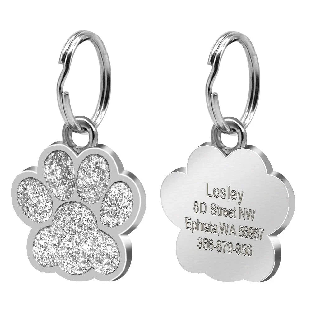 Paw-shaped pet ID tag with rhinestone embellishments, designed for safety and style
