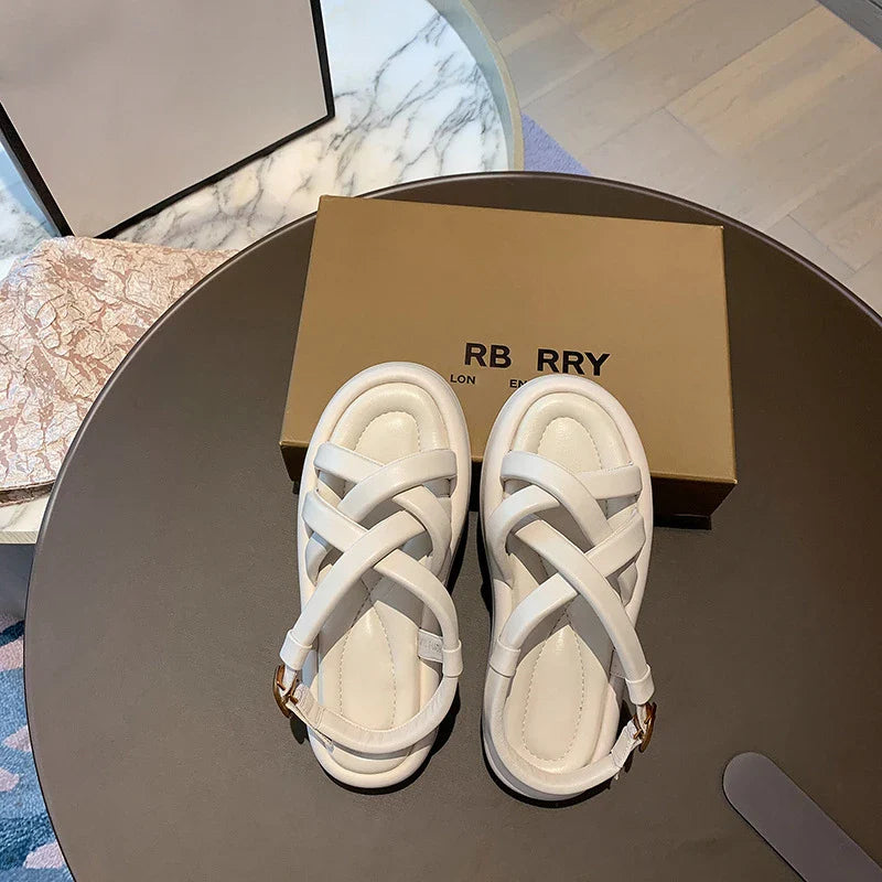 Premium thick-soled sandals in black, beige, and blue colours with a sheepskin upper and rubber sole