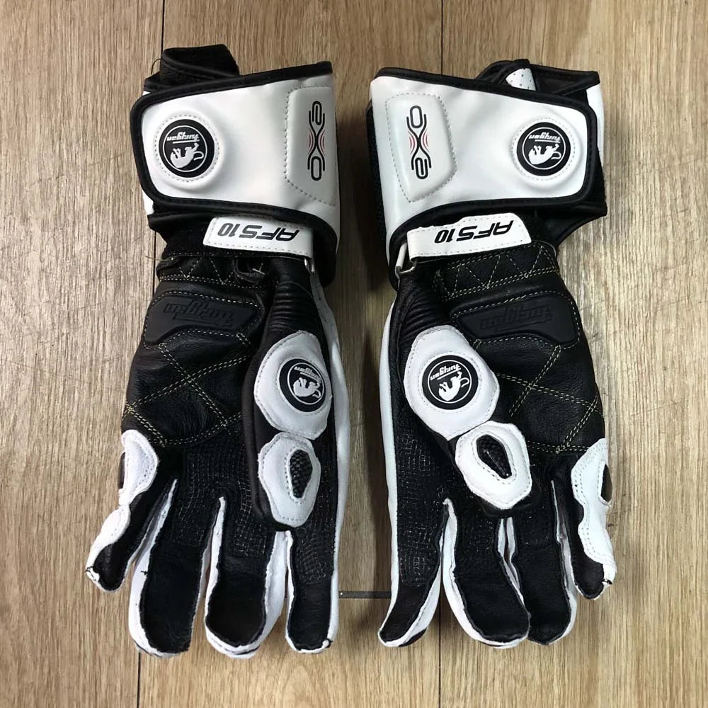 Premium motorcycle gloves made of leather and reinforced with carbon fibre for enhanced protection and breathability
