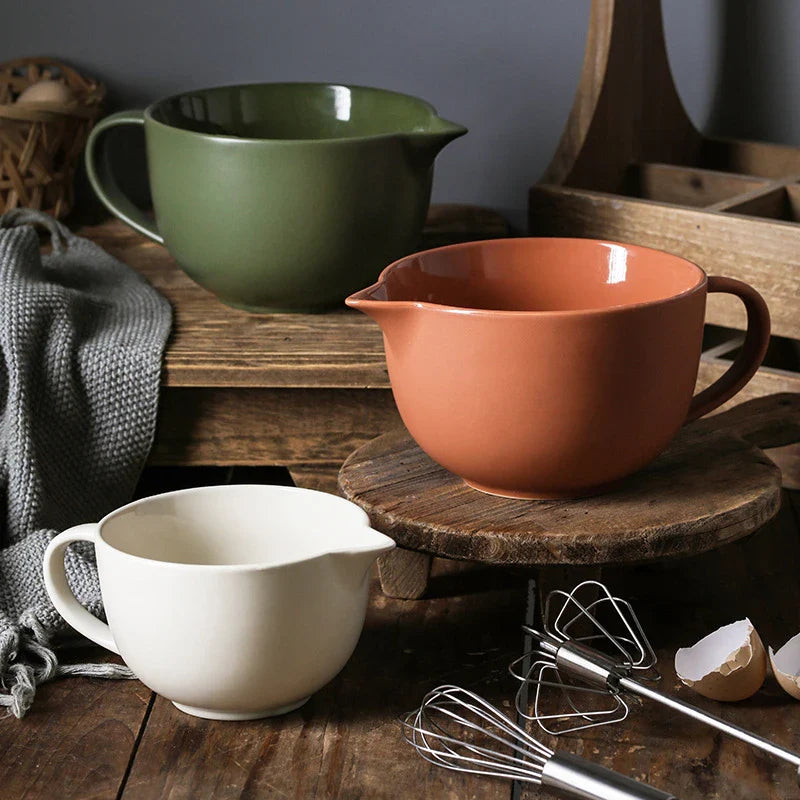 Premium porcelain mixing bowl with ergonomic handle and pointed drainage design for easy baking at home