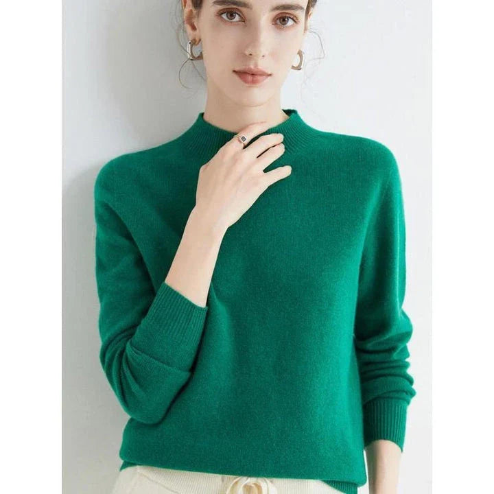 A woman wearing a luxurious Merino wool mock-neck jumper in a stylish autumnal outfit