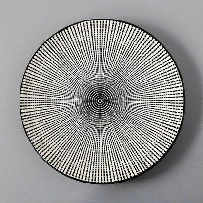 Elegant ceramic plates with vibrant, whimsical prints in a variety of enchanting designs