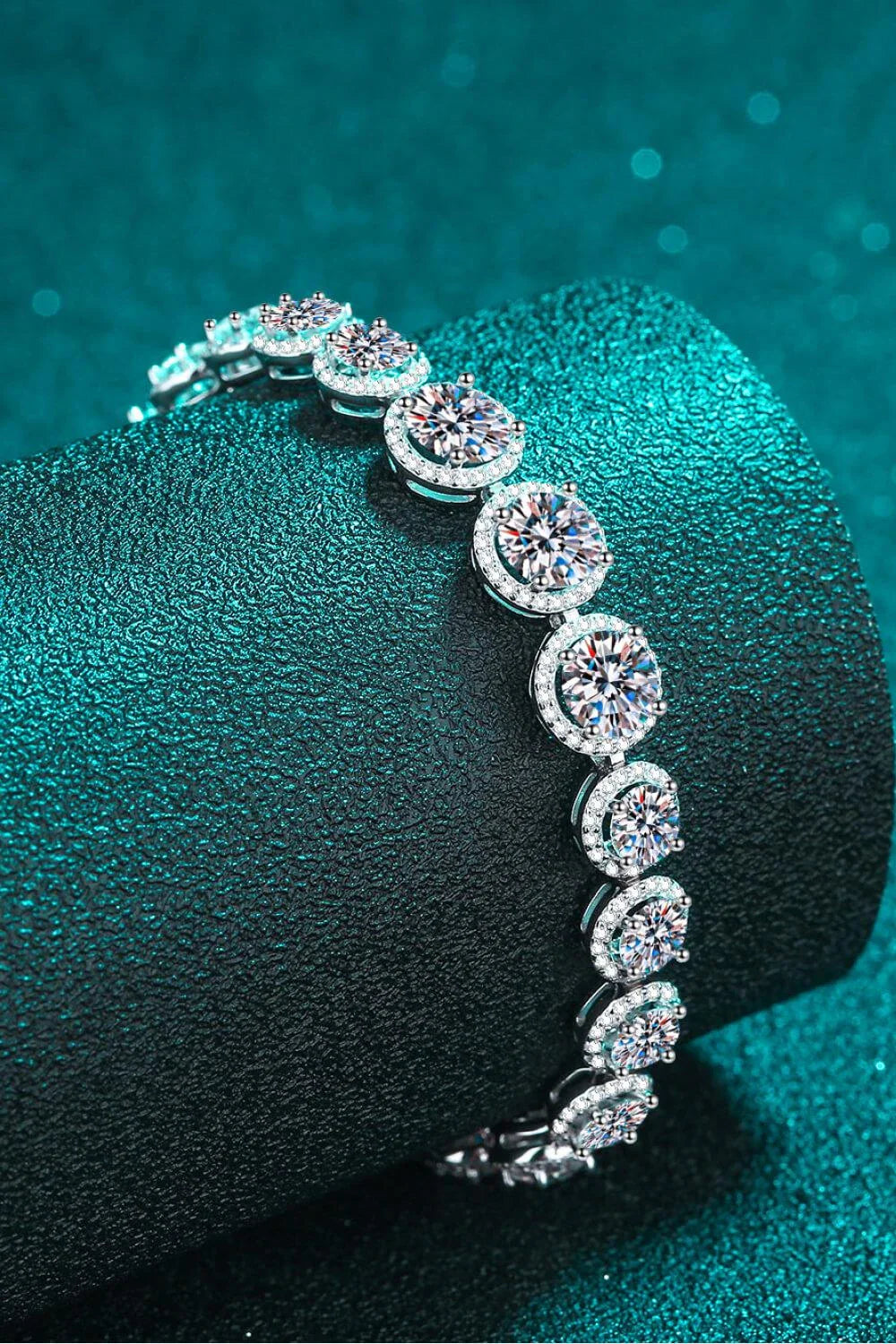 Sparkling moissanite stones set in a polished 925 sterling silver bracelet with a minimalist, elegant design