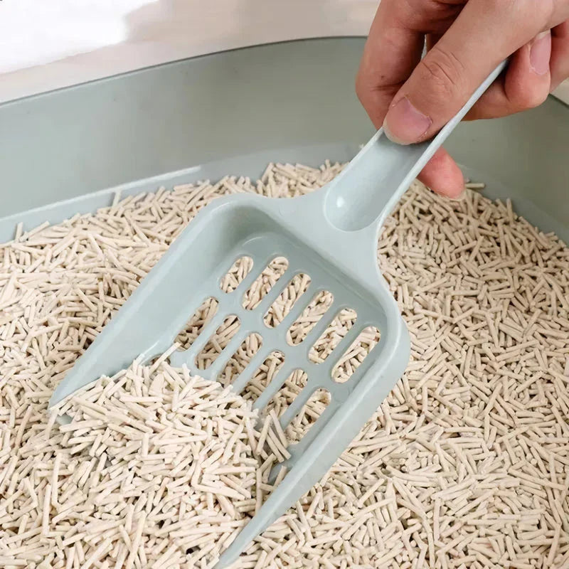A large, high-quality cat litter scoop made of durable plastic with a hollow design for efficient cleaning.